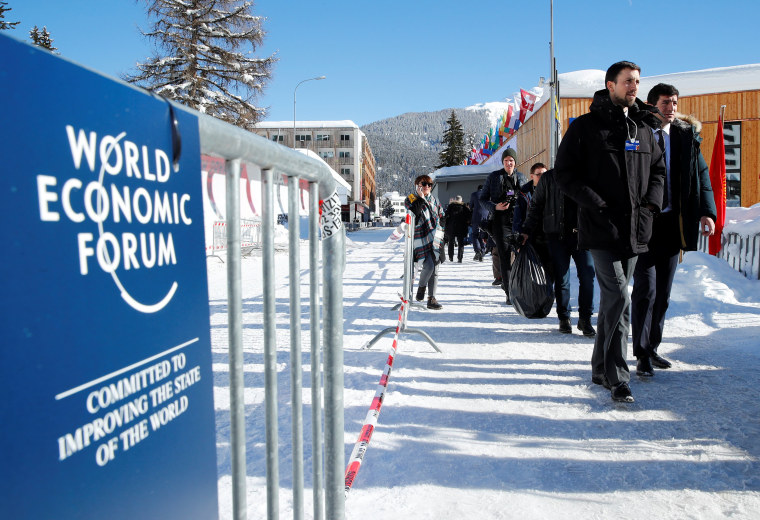 Image: Attendees arrive for the World Economic Forum (WEF) annual meeting in Davos