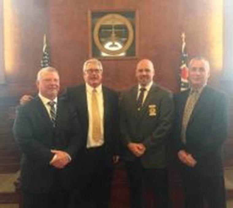 Detective Jeff Seevers (far left) and Detective Bruce Schuck (far right), two members of the Washington County Sheriff's Office Cold Case Squad.