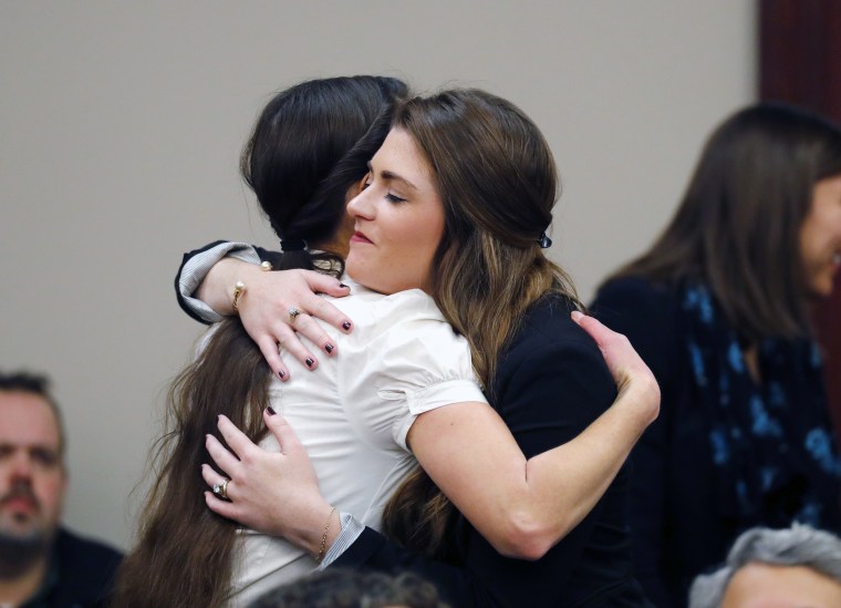 Image: Rachael Denhollander hugs Larissa Boyce