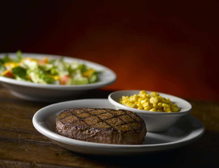 Texas Roadhouse 6 ounce sirloin steak with corn and salad