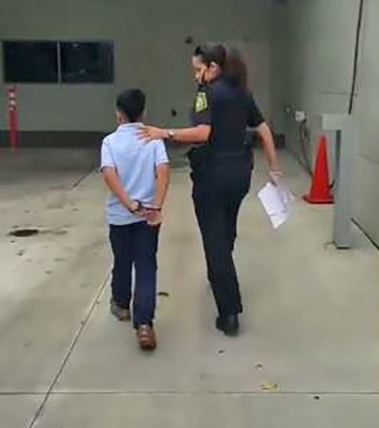 Image: 7-year-old in handcuffs