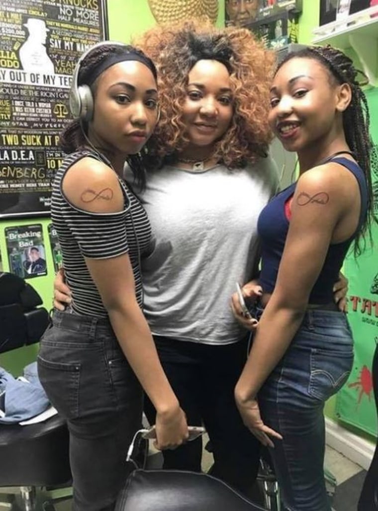 Jholie Moussa, right, with her twin sister Zhane, left, and her mother Syreeta Steward, center.