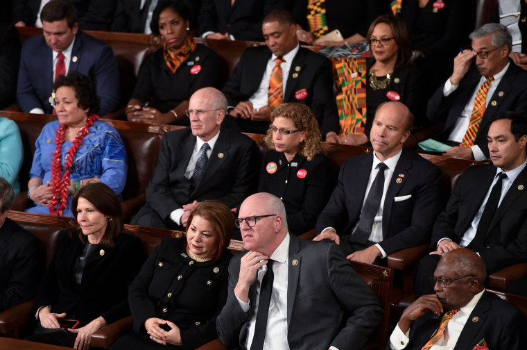 Image: Democratic Senators, House representative, and guests attend the State of the Union