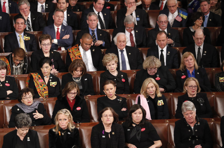 Image: Democratic members of congress listen as U.S. President Trump delivers his State of the Union address in Washington