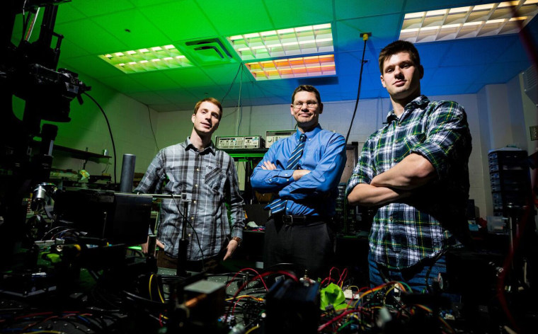 Dr. Daniel Smalley, center, with his student researchers.