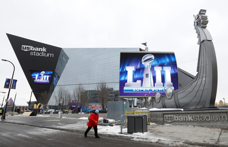 Image: A man walks by US Bank Stadium, home to this weekend's Super Bowl, in downtown Minneapolis, Minnesota