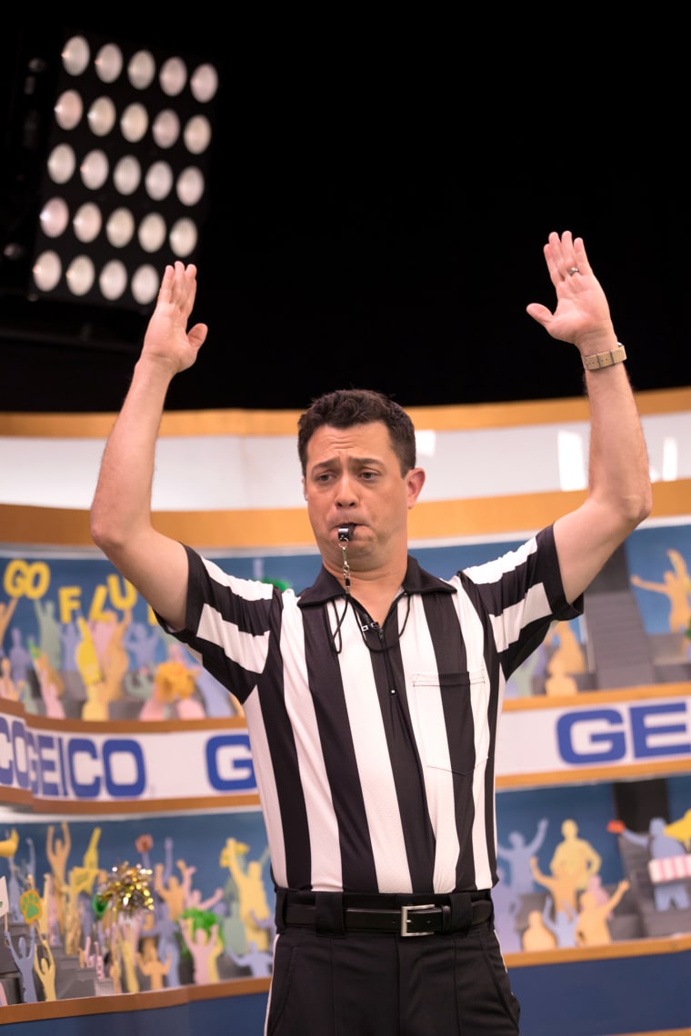 Image: Puppy Bowl Referee Dan Schachner takes the field during Puppy Bowl XIV.