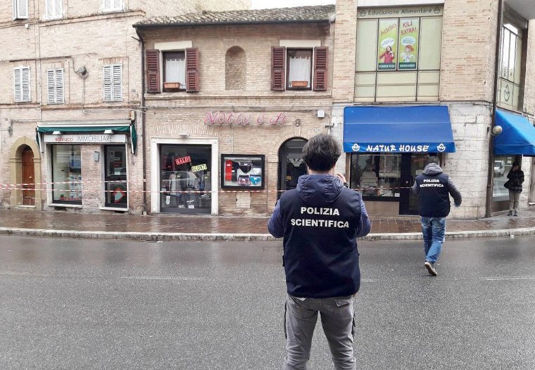 Image: Crime scene investigators work at the scene of crime after a shooting in Macerata, Italy, on Feb. 3, 2018.