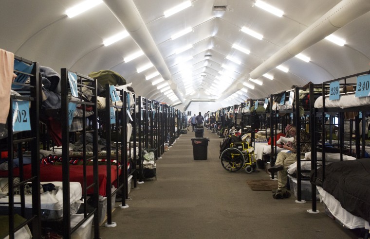 Image: Bunk beds inside a temporary tent operated by Alpha Project