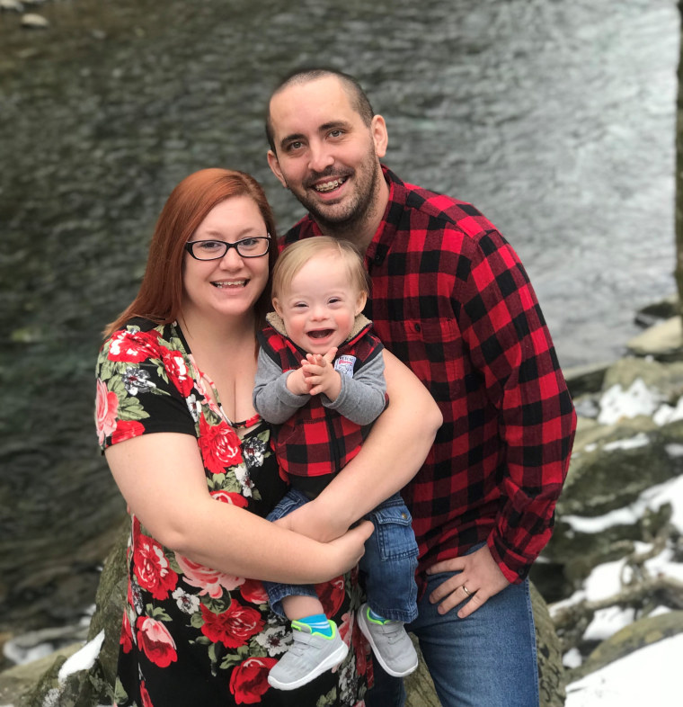 Lucas, 1, with his parents, Cortney and Jason Warren.