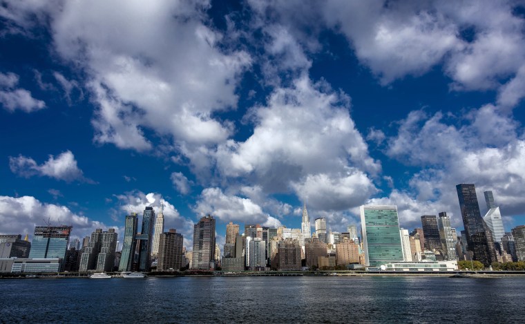 Skyline of Midtown Manhattan seen from the East River showing the Chrysler Building and the United Nations building, New York