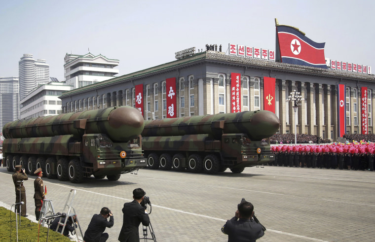 Image: Missiles are paraded across Kim Il Sung Square during a military parade