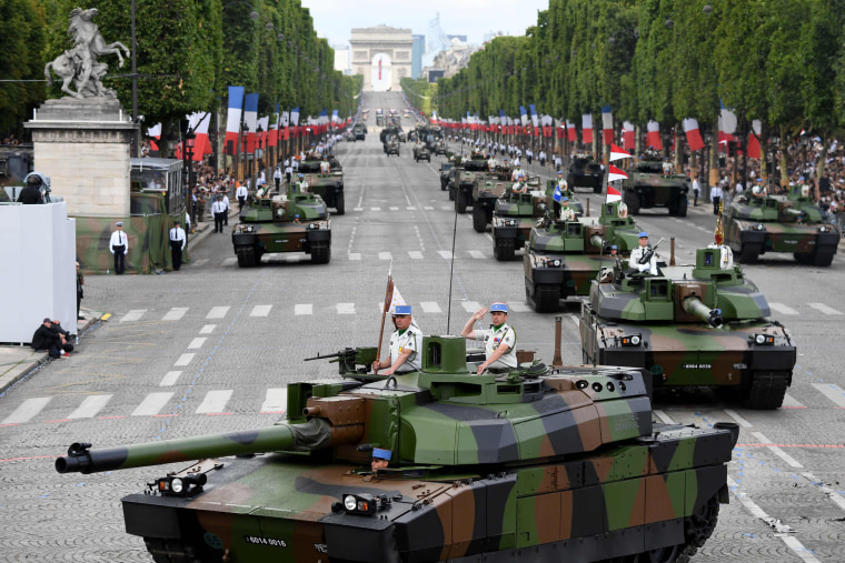 Members of the 5e Regiment de Dragons (5th Dragoon Regiment) parade on Leclerc tanks during the annual Bastille Day military parade on the Champs-Elysees avenue in Paris on July 14, 2017.

The parade on Paris's Champs-Elysees will commemorate the centenary of the US entering WWI and will feature horses, helicopters, planes and troops. / AFP PHOTO / ALAIN JOCARDALAIN JOCARD/AFP/Getty Images