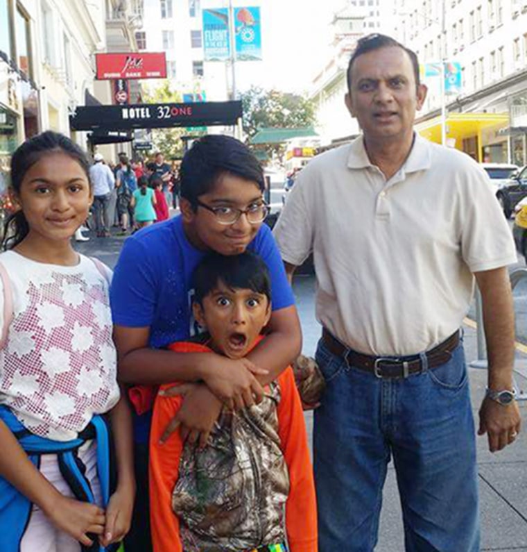 Image: Syed Ahmed Jamal, seen with his three kids, was arrested the lawn of his Kansas home on Jan. 24.