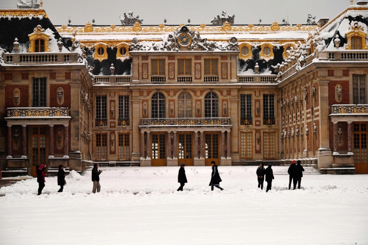 People walk outside Versailles on Feb. 7, outside of Paris.
