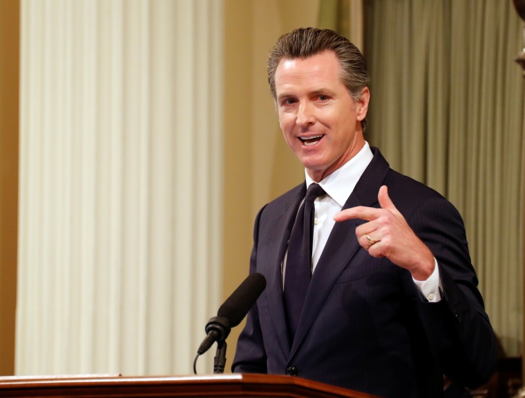 Image: Lt. Gov. Gavin Newsom speaks before introducing California Gov, Jerry Brown who was delivering his final state of the state address, ending his fourth term as governor in Sacramento