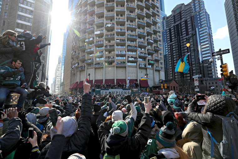 Fans celebrate with the Philadelphia Eagles during their NFL Super Bowl victory parade on Feb. 8, 2018 in Philadelphia.