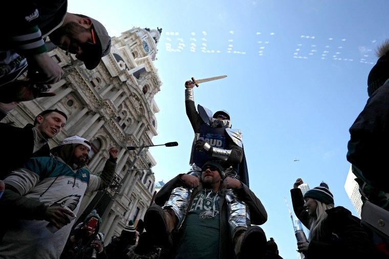 Fans celebrate with the Philadelphia Eagles during their NFL Super Bowl victory parade on February 8, 2018 in Philadelphia.