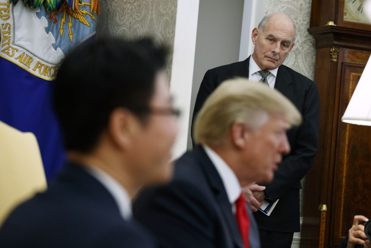 Image: White House Chief of Staff John Kelly listens during a meeting