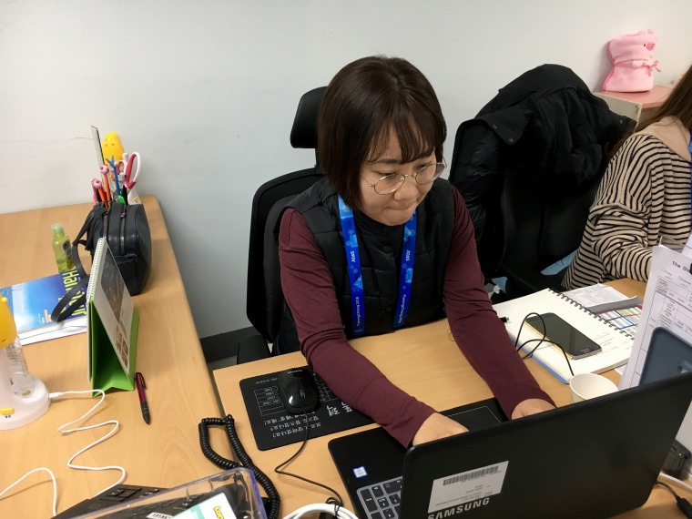Image: Jeon Won Hee, a counselor with Gender Equality Support Center, works in the Olympic Park to respond to sexual assault victims.