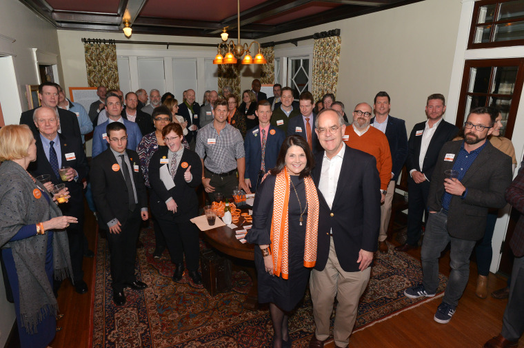 University of Tennessee alumni raise money for the school's LGBTQ Pride Center at a private home in Nashville, Tenn., on Feb. 1, 2018. They are joined by U.S. Rep. Jim Cooper and U.T. Chancellor Beverly Davenport.