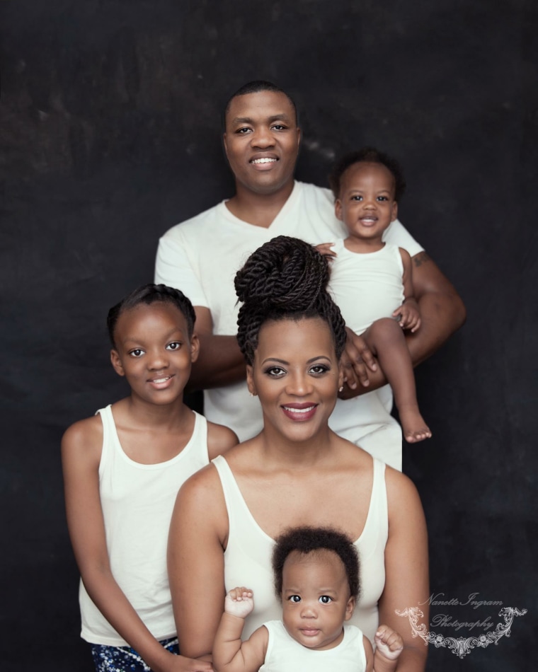 Image: A family portrait of Lakesha Cole and her husband, GySgt. Deonte Cole, and children Kailey Mariah, 12, Kirby Marie, 3, and Keegan Milo, 2.