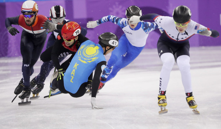 Hongzhi Xu of China and Nurbergen Zhumagaziyev of Kazakhstan collide and crash out during the men's 1,500 meter short track speed skating heat on Feb. 10.