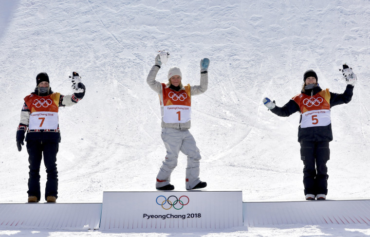 From left: silver medal winner Laurie Blouin, of Canada, gold medal winner Jamie Anderson, of the United States, and bronze medal winner Enni Rukajarvi, of Finland, celebrate after the women's slopestyle final.