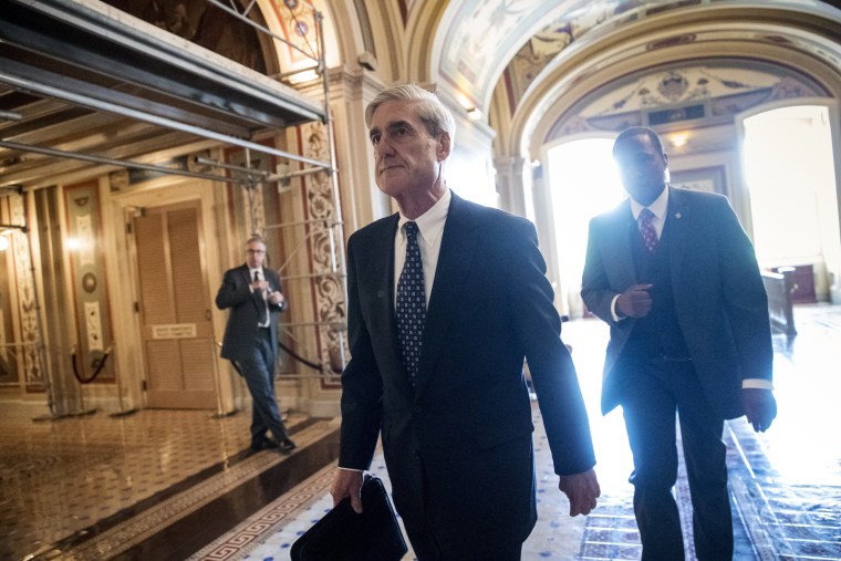 Image: Robert Mueller departs after a closed-door meeting