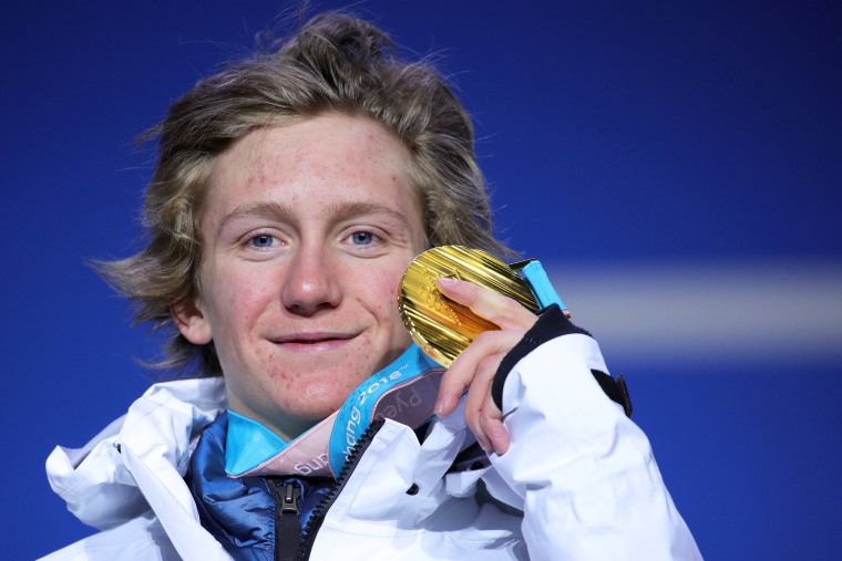 Image: Gold medalist Red Gerard of the United States poses on the podium during the medal ceremony