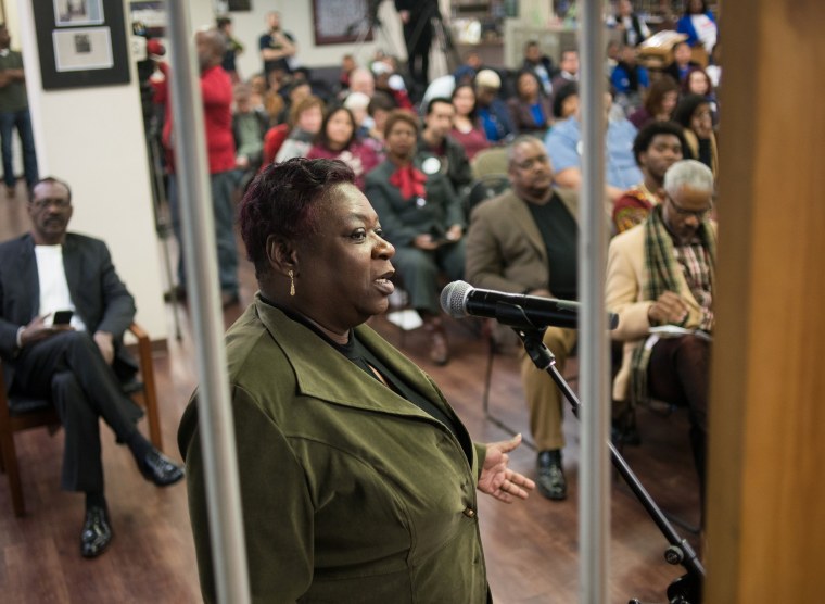 Image: Robbie Frazier of Dallas, a former inmate of 20 years, asks a question to the two Dallas County district attorney candidates