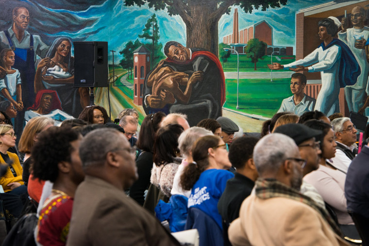 Image: Members of the audience listen to Dallas County District Attorney candidates