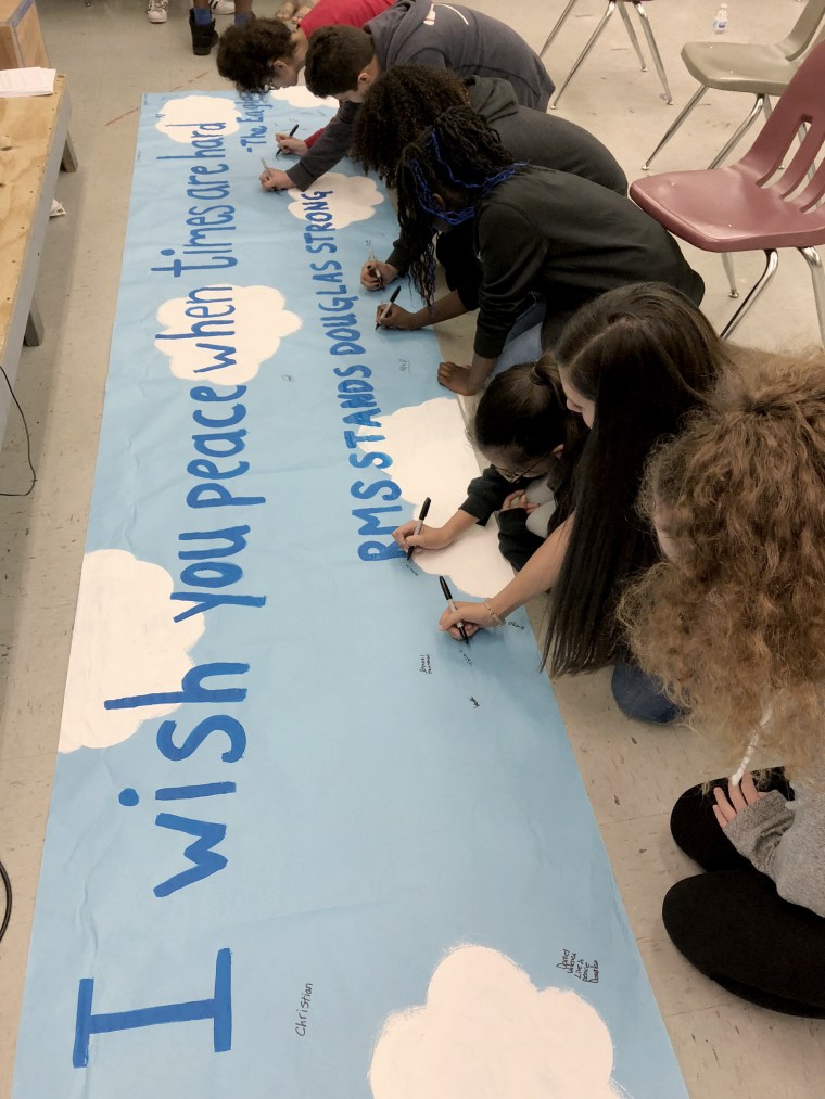 Image: Students at Ramblewood Middle School in Broward County, Florida, paint a banner during drama class for students at Stoneman Douglas High School, on Feb. 16, 2018.