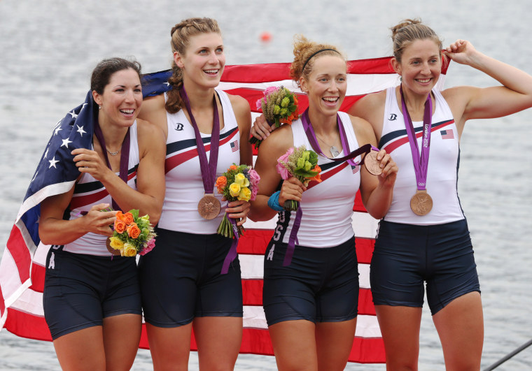 Image: U.S. rowers Adrienne Martelli, Megan Kalmoe, Kara Kohler, and Natalie Dell display the bronze medals they won