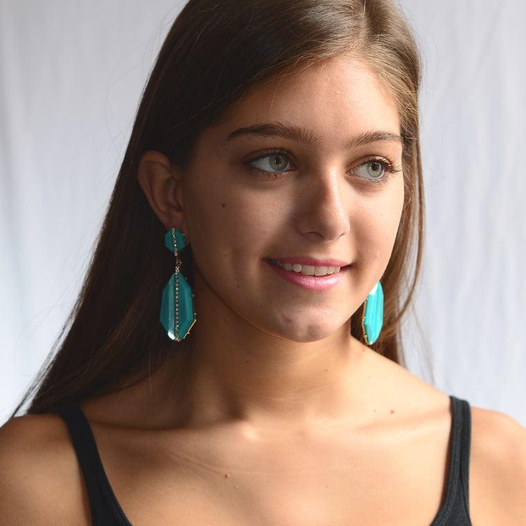 Woman wearing turquioise earrings