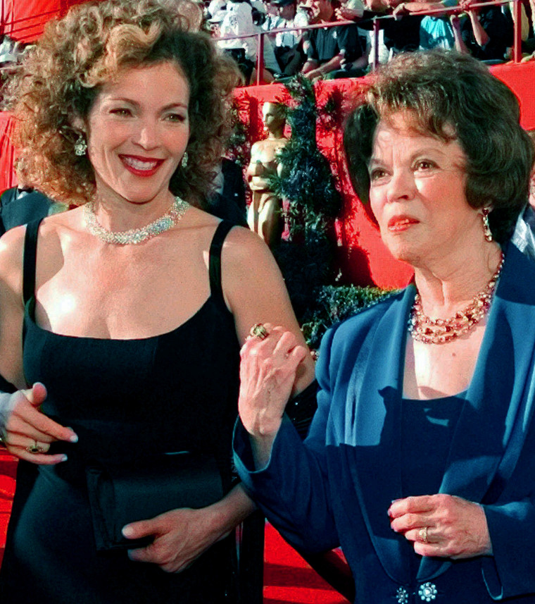 Actress Amy Irving, left, talks with Shirley Temple Black as they greet each other at the 70th Academy Awards at the Shrine Auditorium in Los Angeles March 23, 1998.