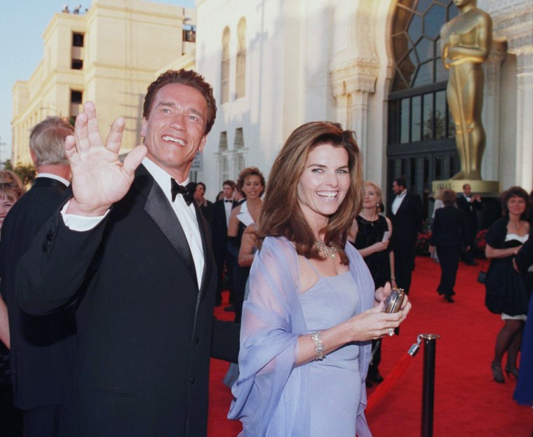 Arnold Schwarzenegger and his wife reporter Maria Shriver arrive for the 70th Annual Academy Awards 23 March in Los Angeles, CA.
