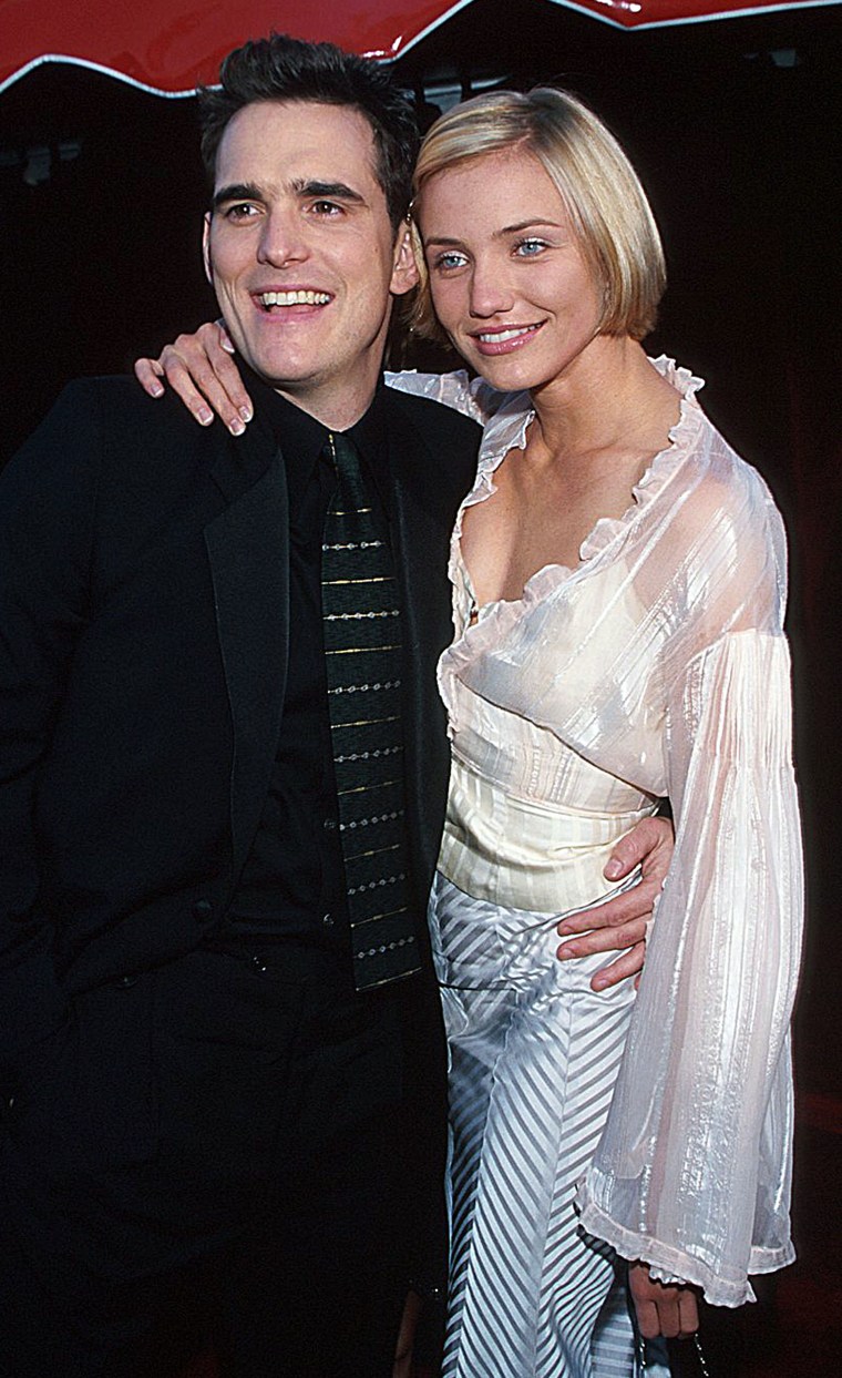 Matt Dillon and Cameron Diaz during The 70th Annual Academy Awards - Red Carpet at Shrine Auditorium in Los Angeles, California.