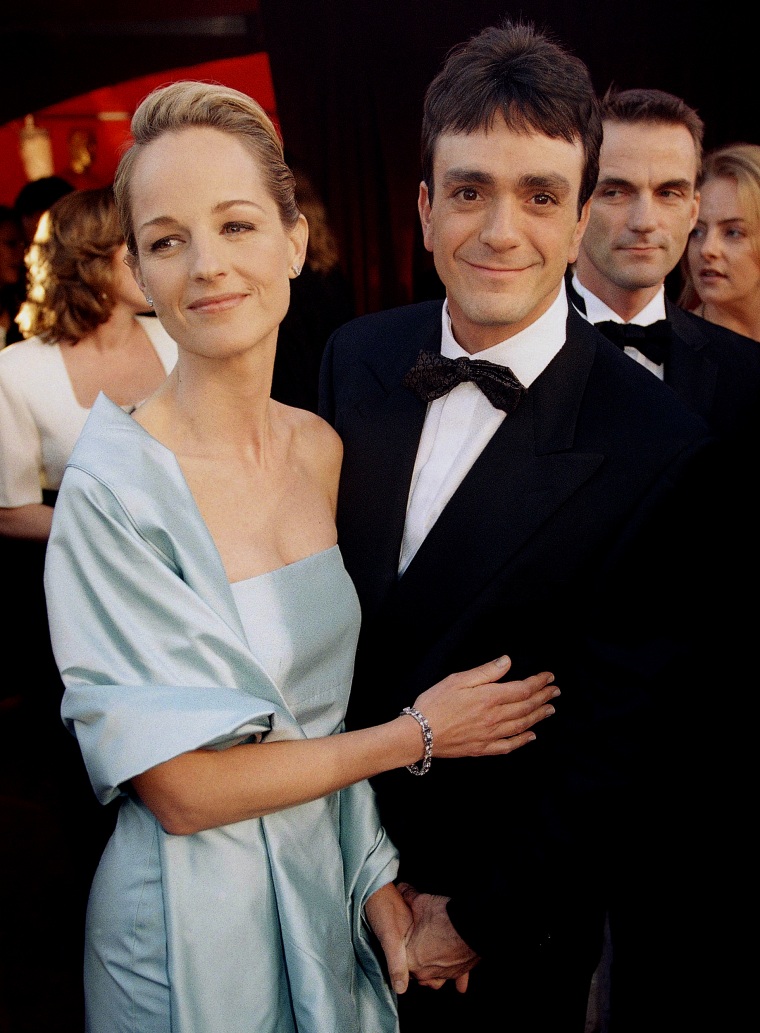 Helen Hunt, winner in the Best Actress category for her performance in the film As Good As It Gets, arrives at the 70th Annual Academy Awards with actor Hank Azaria at the Shrine Auditorium in Los Angeles on March 23, 1998.