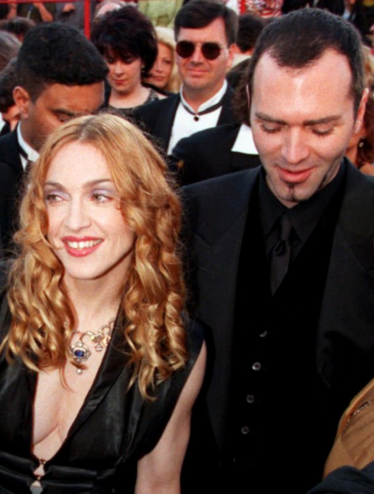 Madonna and her brother Christopher Ciccone arrive for the 70th Academy Awards show, Monday, March 23, 1998 in Los Angeles.