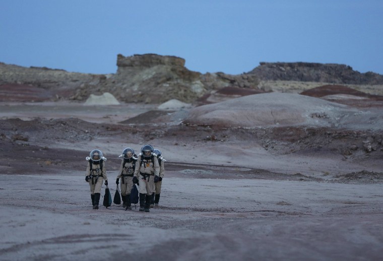 Image: Members of Crew 125 EuroMoonMars B mission return after collecting geologic samples in the Utah desert