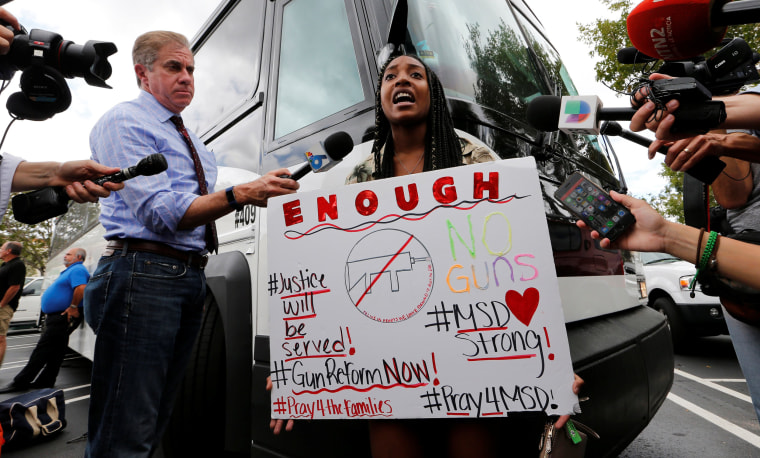 Image: Tyra Hemans, 19, a senior at Marjory Stoneman Douglas High School, speaks before boarding busses with other students to travel to Tallahassee, Florida, to meet with legislators, in Coral Springs