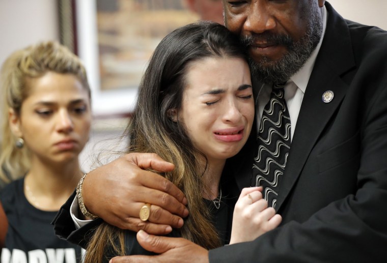 Image: Aria Siccone, 14, a 9th grade student from Marjory Stoneman Douglas High School, cries