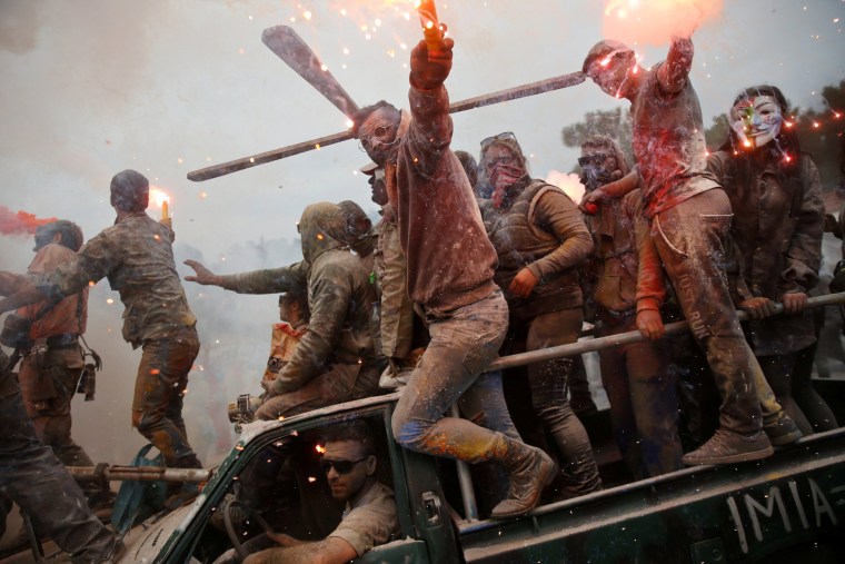 Image: Revellers celebrate \"Ash Monday\" by participating in a colourful \"flour war\", a traditional festivity marking the end of the carnival season and the start of the 40-day Lent period until the Orthodox Easter, in Galaxidi