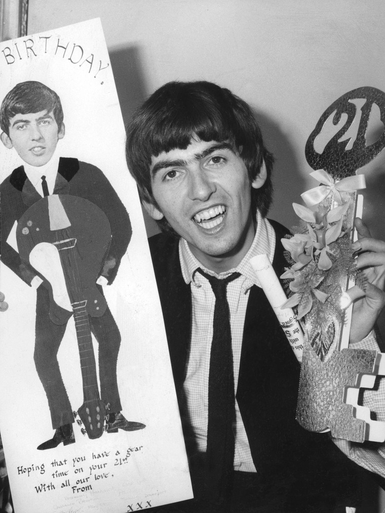 Image: George Harrison celebrates his 21st birthday on Feb. 25, 1964