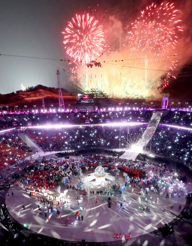 Fireworks illuminate the sky.