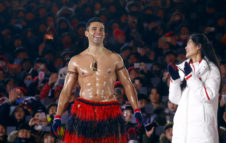 Pita Taufatofua, of Tonga, receives applause during the closing ceremony.