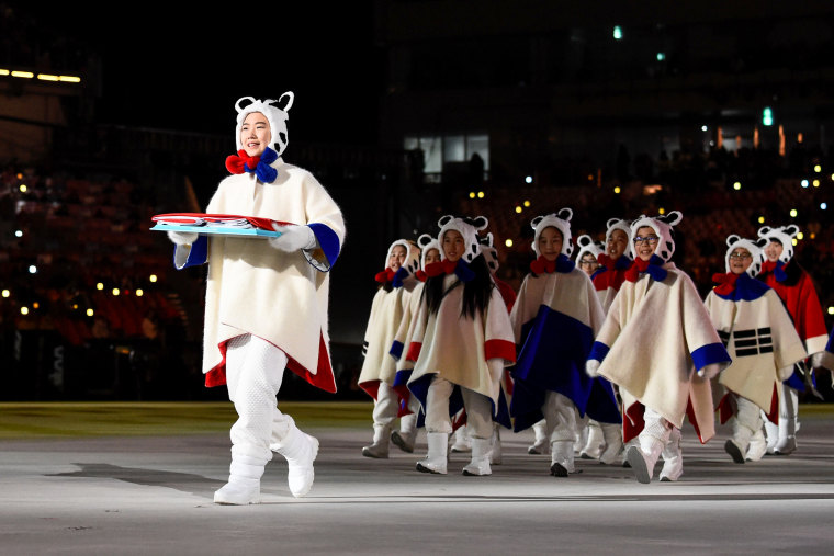 The South Korean flag is delivered tot he stadium.