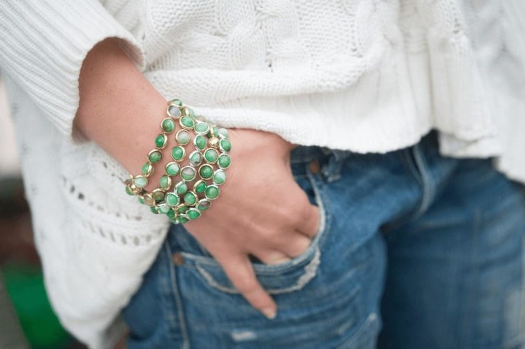 Green stack bracelets with jeans