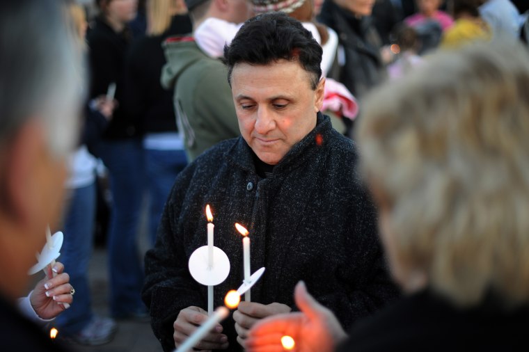 Frank Deangelis of Columbine High School Principal is in candlelight Vigil to honor and remember those touched by the tragedy at the Columbine Memorial in Clement Park, Littleton, CO. on Sunday. Hyoung Chang, The Denver Post